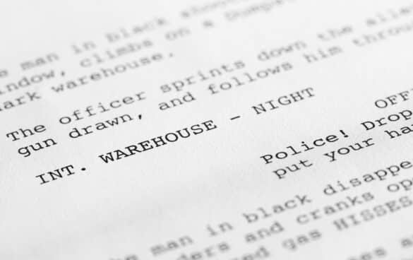 Close-up of a page from a screenplay or script in proper Hollywood format